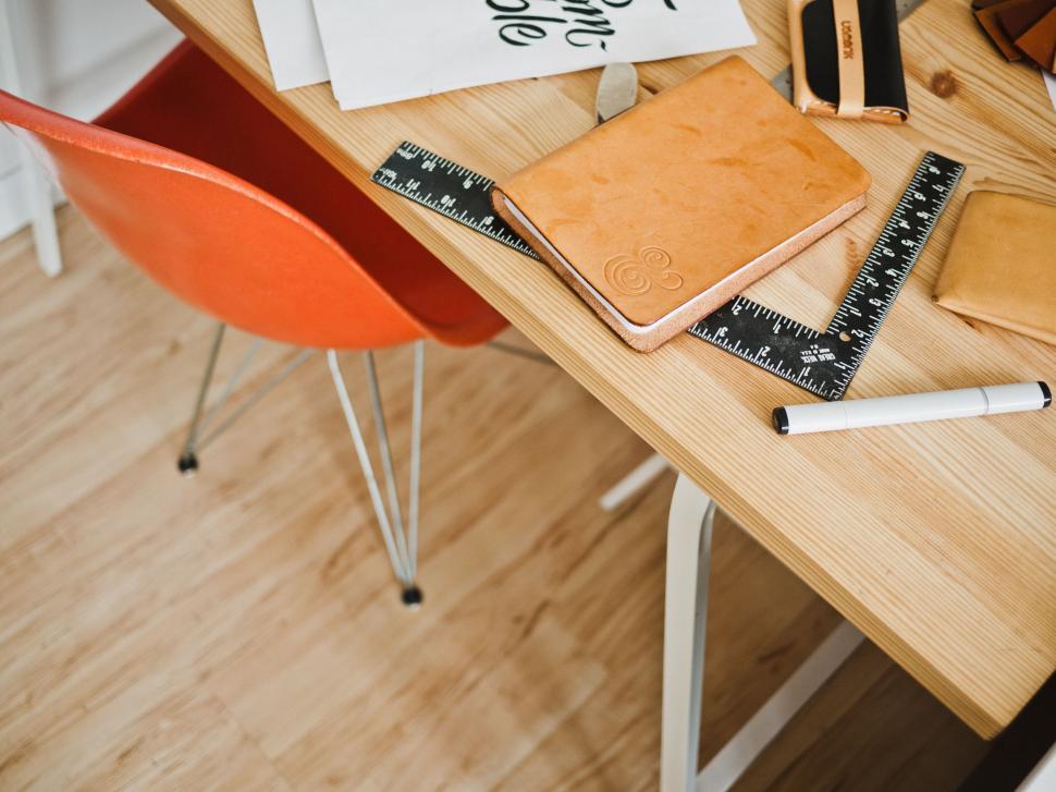 Free Image of Wooden Desk With Notebook and Calculator 