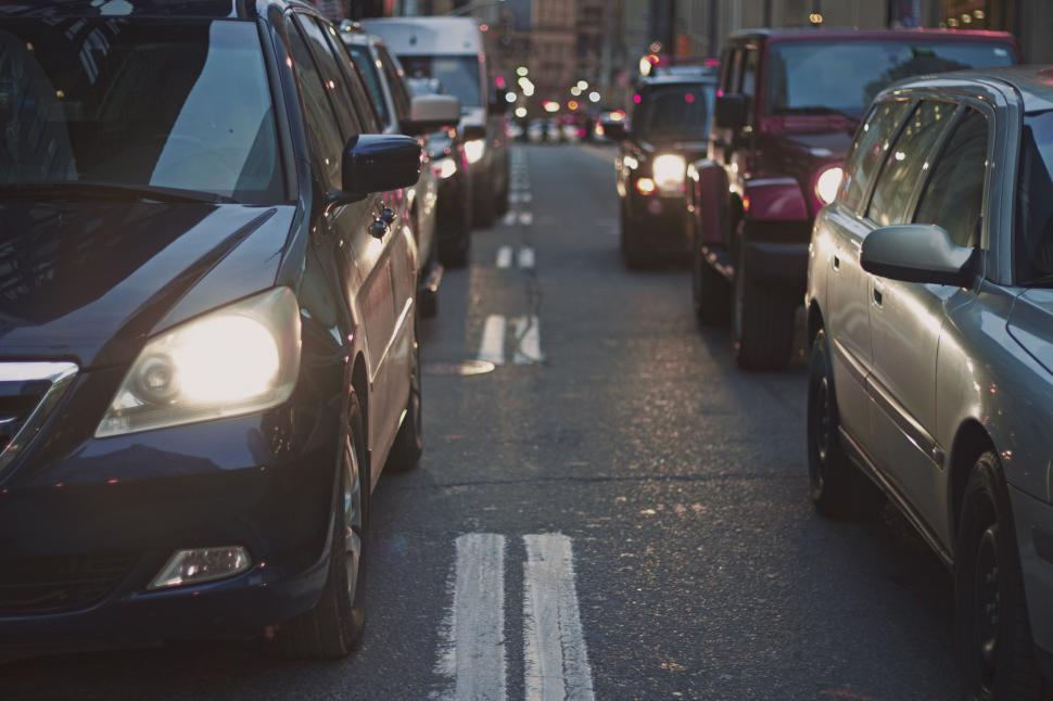 Free Image of Busy Street With Traffic and Tall Buildings 