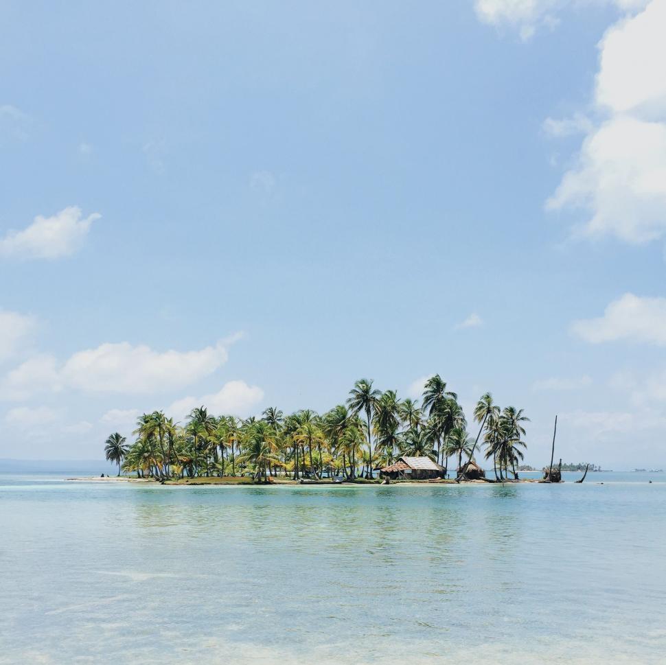 Free Image of Small Island in the Middle of a Body of Water 