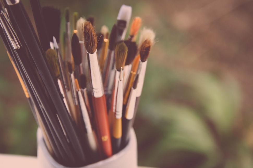Free Image of Cup Filled With Paint Brushes 
