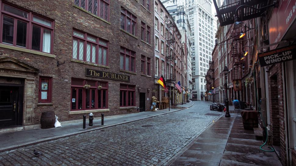 Free Image of Narrow City Street With Brick Buildings 