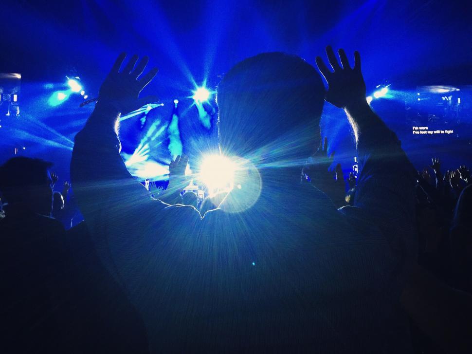 Free Image of Energetic Crowd Raises Hands at Concert 