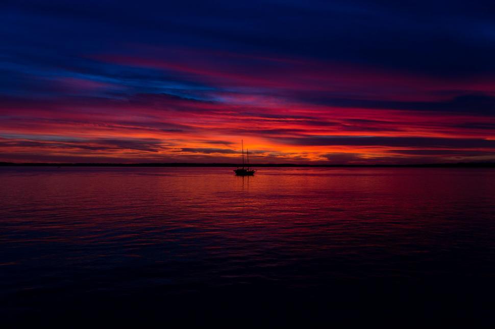 Free Image of Boat Floating on Large Body of Water 
