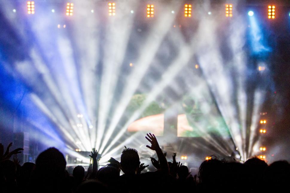 Free Image of Crowd of People Standing on Top of a Stage 