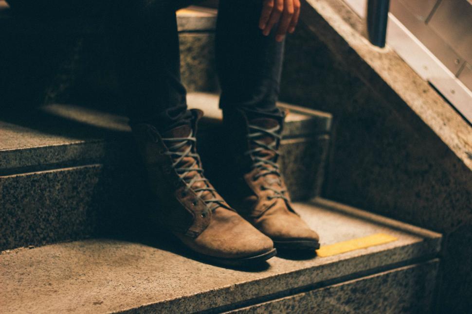 Free Image of Person Sitting on Stairs 