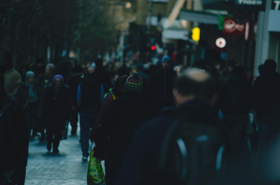 Free Image of Crowd of People Walking Down Urban Street 