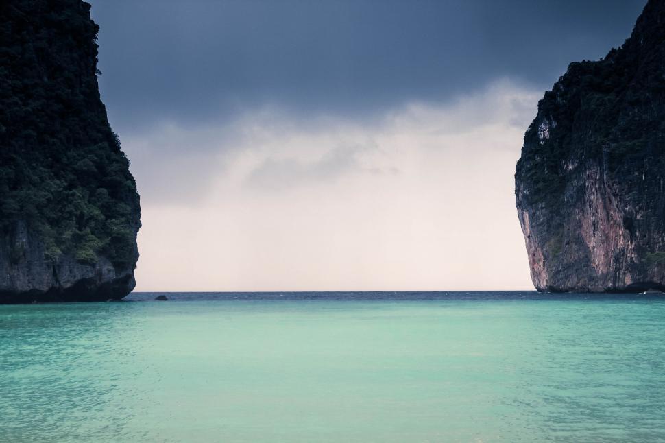 Free Image of Two Large Rocks Emerging From the Ocean 
