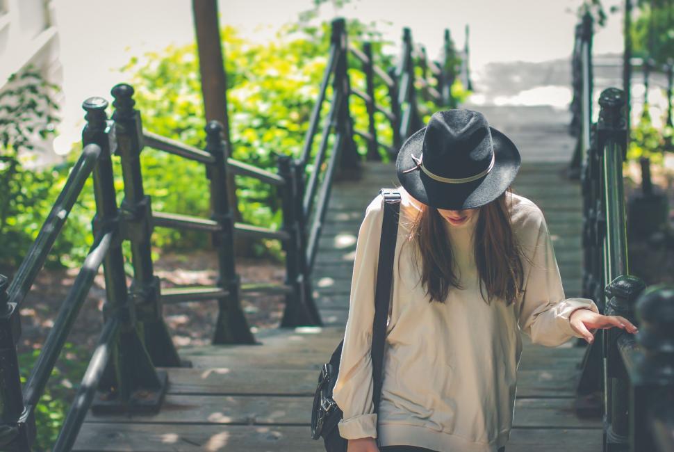 Free Image of Woman With a Hat Descending Stairs 