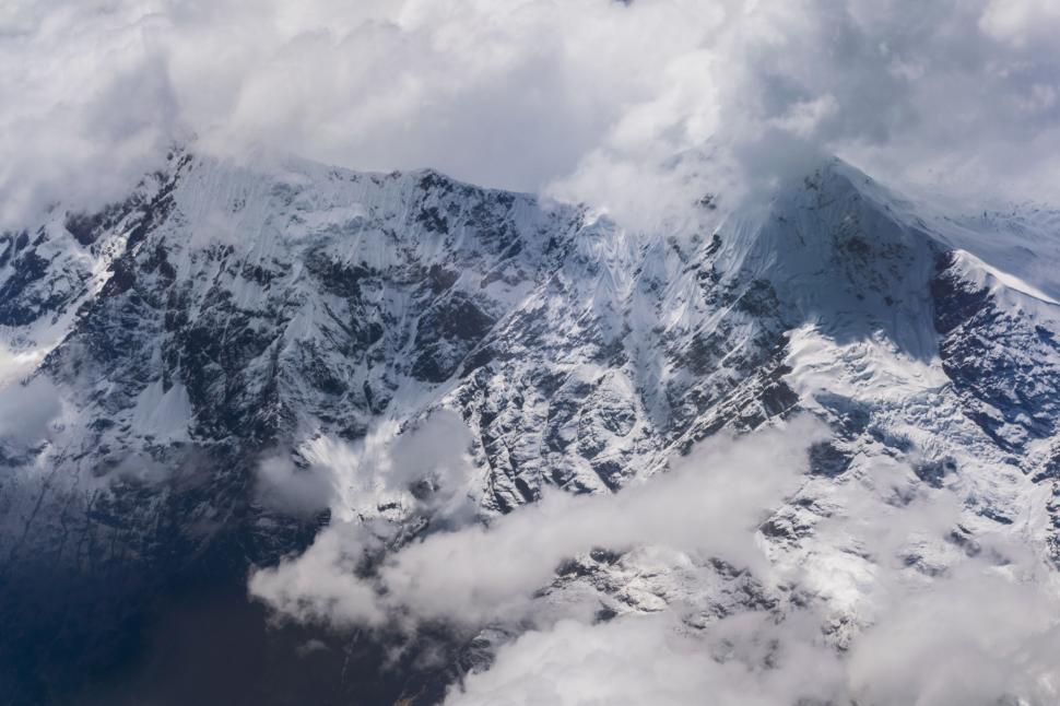 Free Image of Aerial View of Snow Covered Mountain 