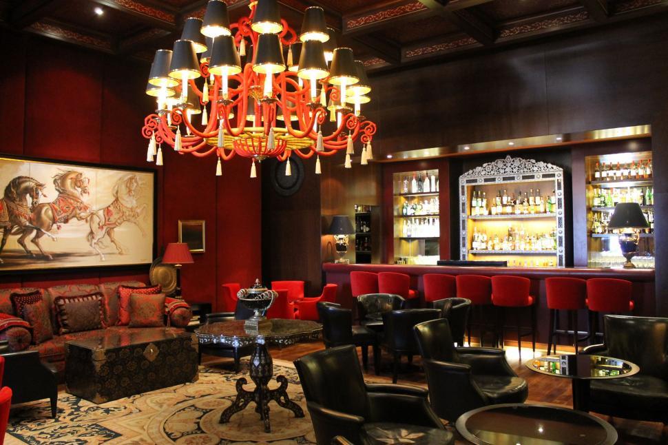 Free Image of Room With Many Chairs and a Chandelier 
