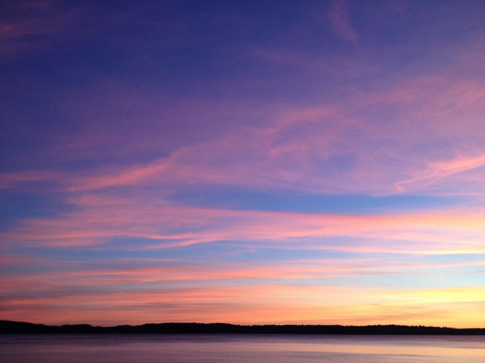 Free Image of Boat Floating on Water at Sunset 