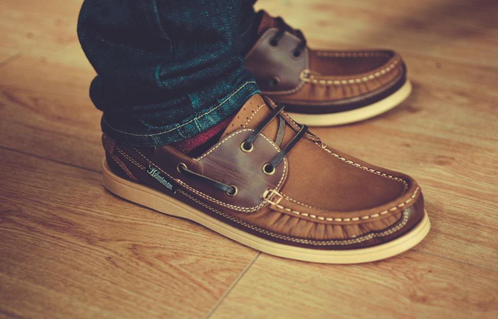 Free Image of Person Standing on Top of Wooden Floor 