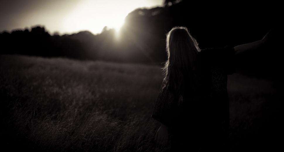 Free Image of Woman Standing in Field at Night 