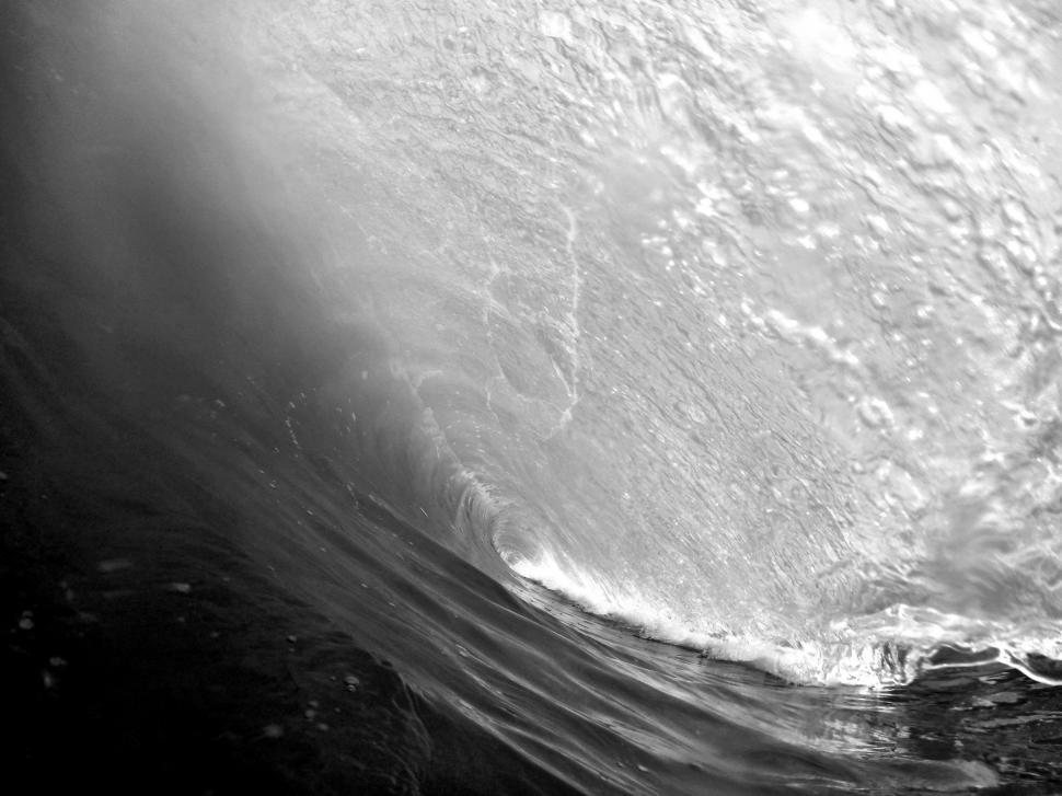 Free Image of Man Riding Wave on Surfboard 