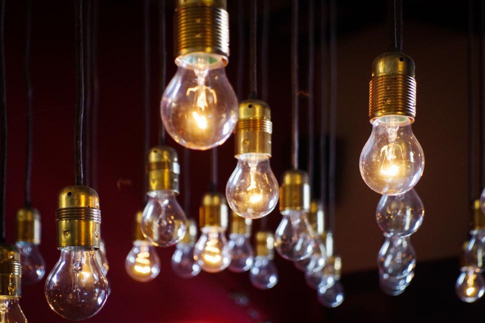 Free Image of Array of Light Bulbs Hanging From Ceiling 