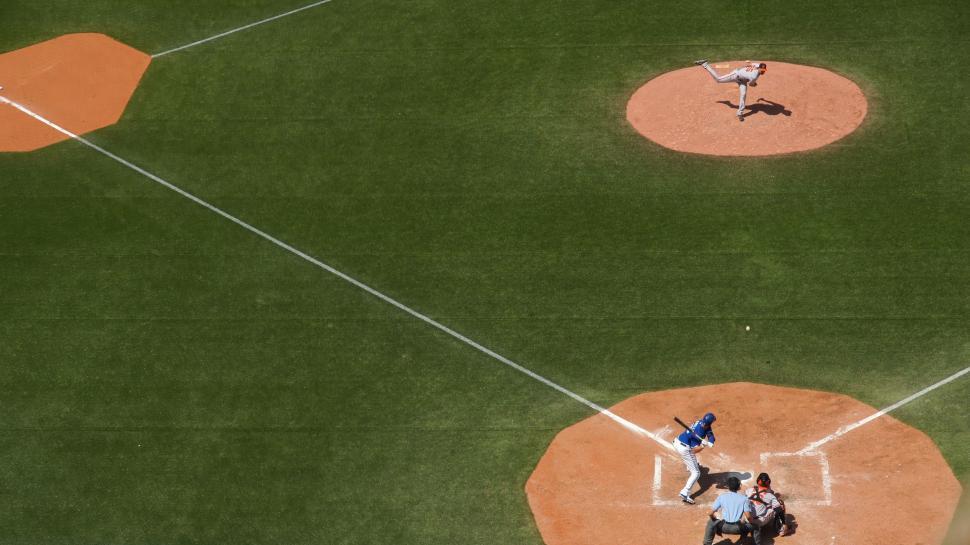 Free Image of Baseball Player Swinging Bat at Ball 