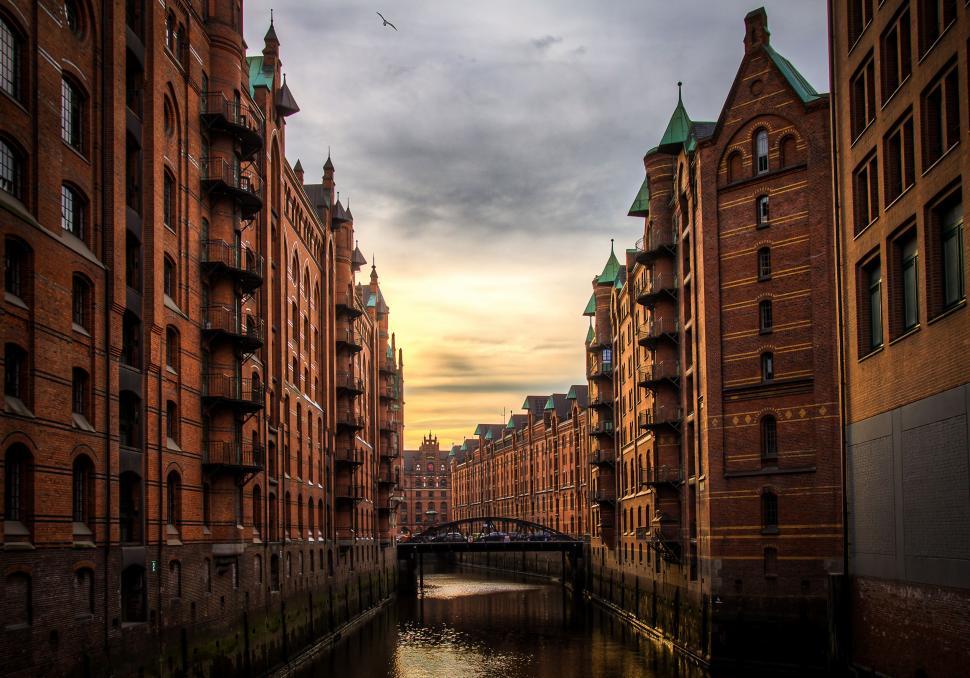 Free Image of River Running Through City Next to Tall Buildings 