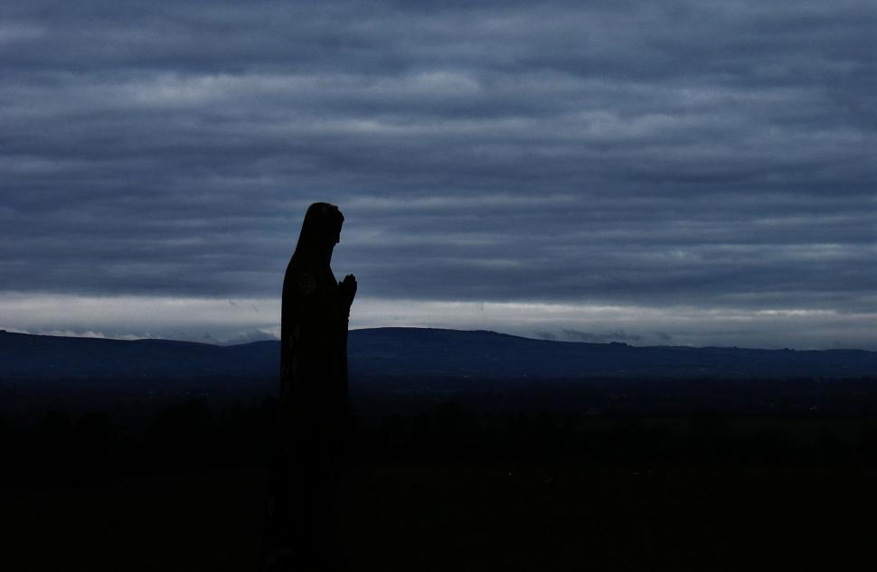 Free Image of Person Standing in the Dark Silhouette 