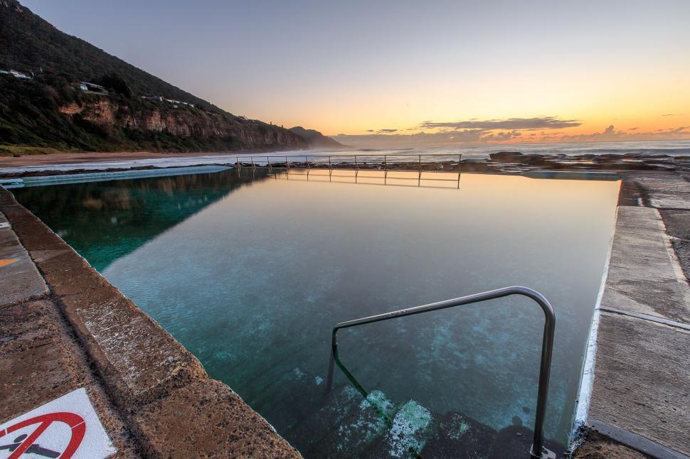 Free Image of Large Swimming Pool Adjacent to Beach 