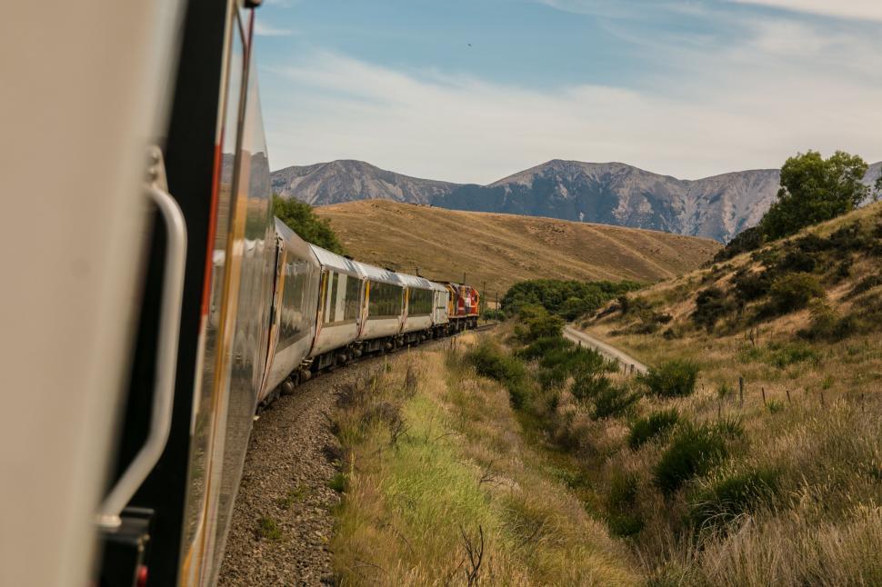 Free Image of Train Passing Through Lush Green Countryside 