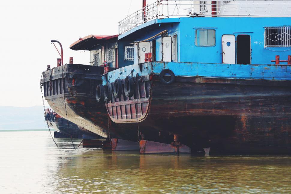 Free Image of Large Boat Floating on Body of Water 