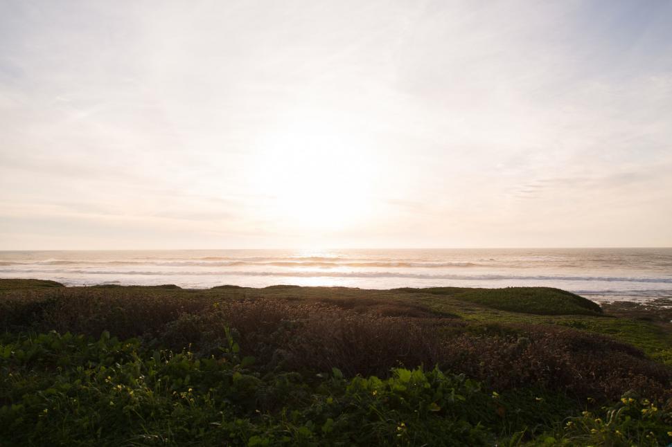 Free Image of The Sun Shines Brightly Over the Ocean 