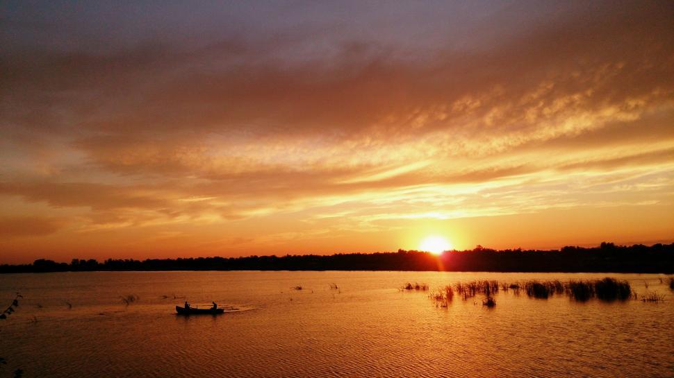 Free Image of Sunset Over Body of Water With Boats 