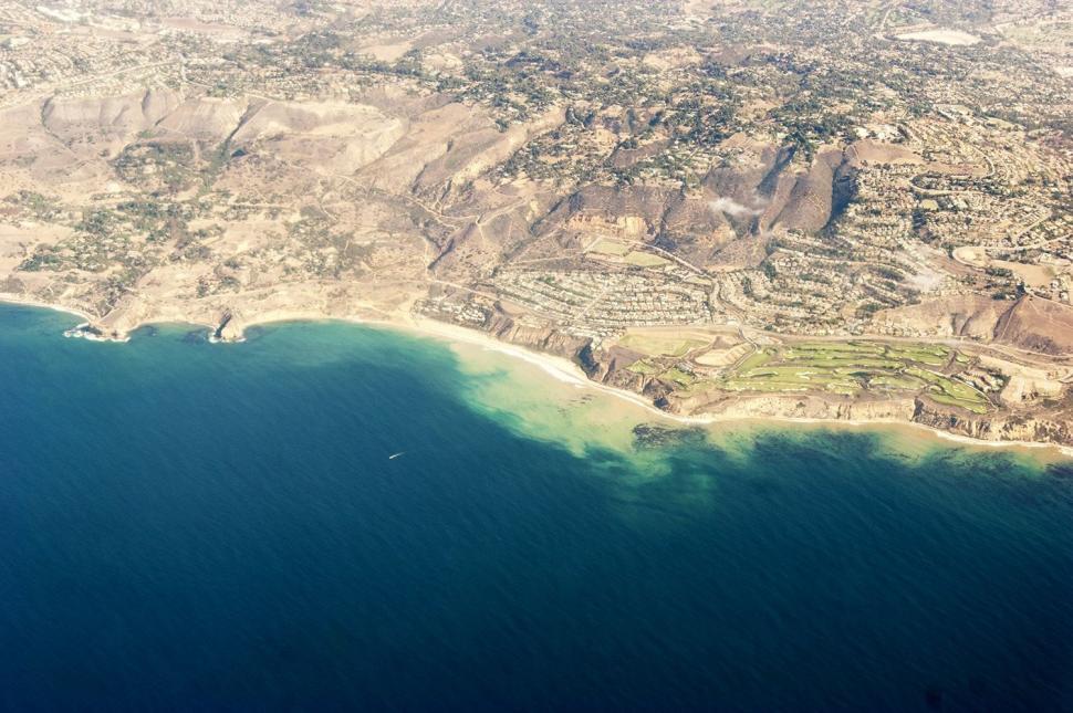 Free Image of Aerial View of a Vast Water Body 
