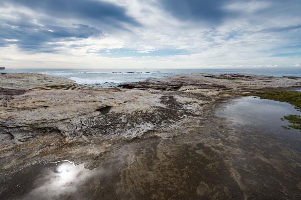 Free Image of Large Body of Water on Sandy Beach 
