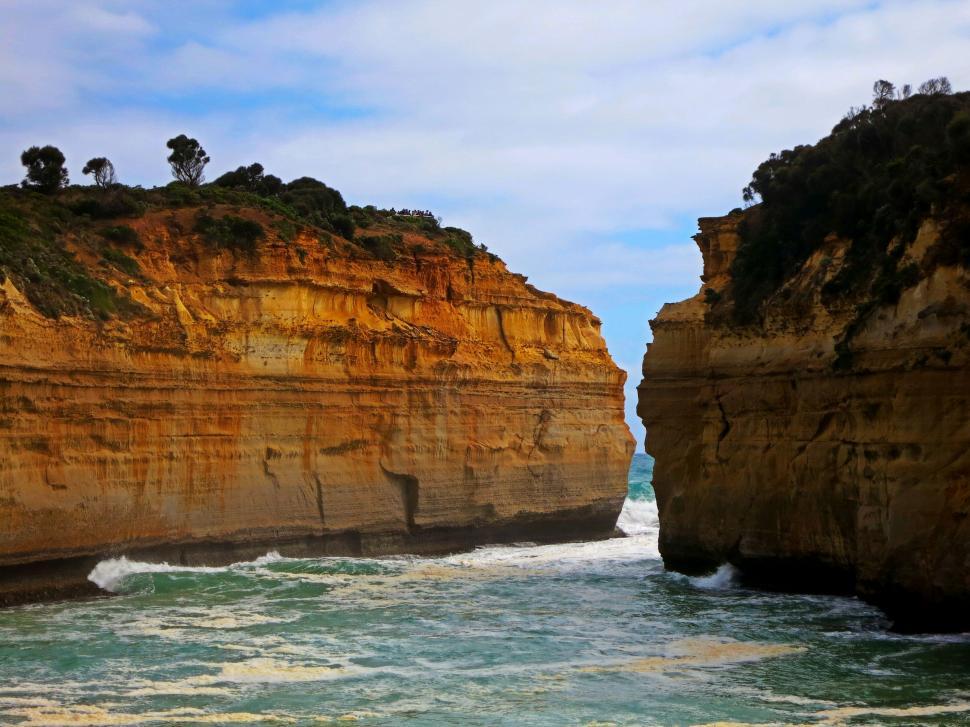 Free Image of Large Rocks Resting on Sandy Beach 