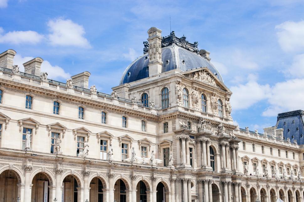 Free Image of Large White Building Against Blue Sky 