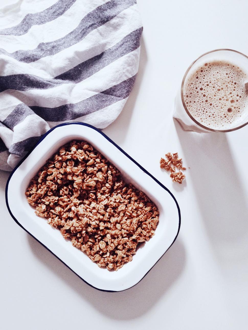 Free Image of Cereal Bowl and Milk Glass on Table 