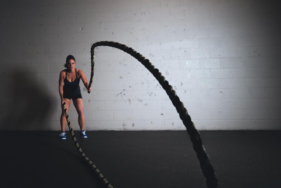 Free Image of Woman Holding Rope in Dark Room 