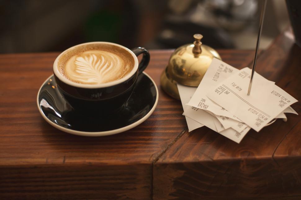 Free Image of A Cup of Coffee on Wooden Table 