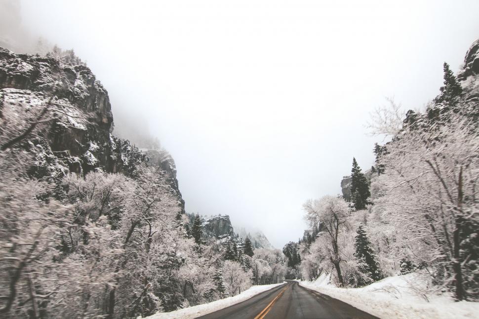Free Image of Snowy Road Through Black and White Lens 