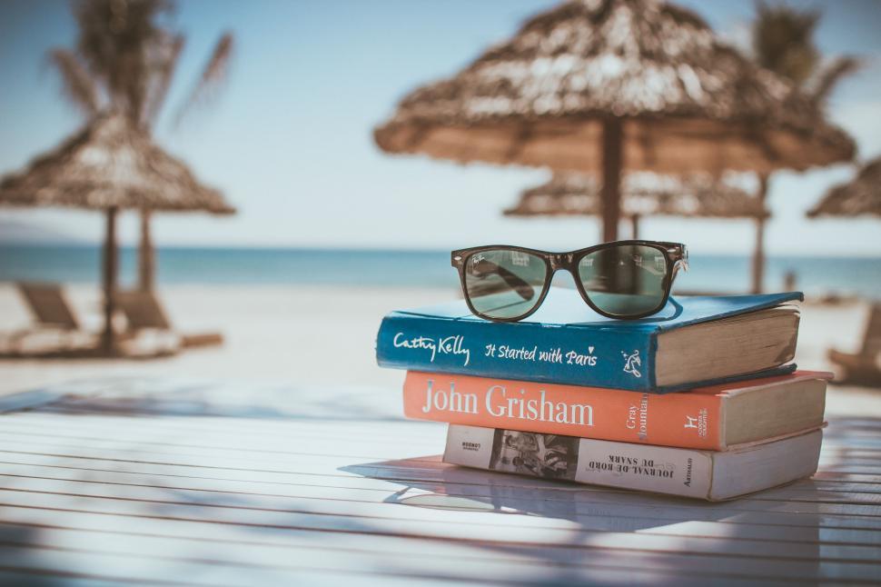 Free Image of Stack of Books on Wooden Table 