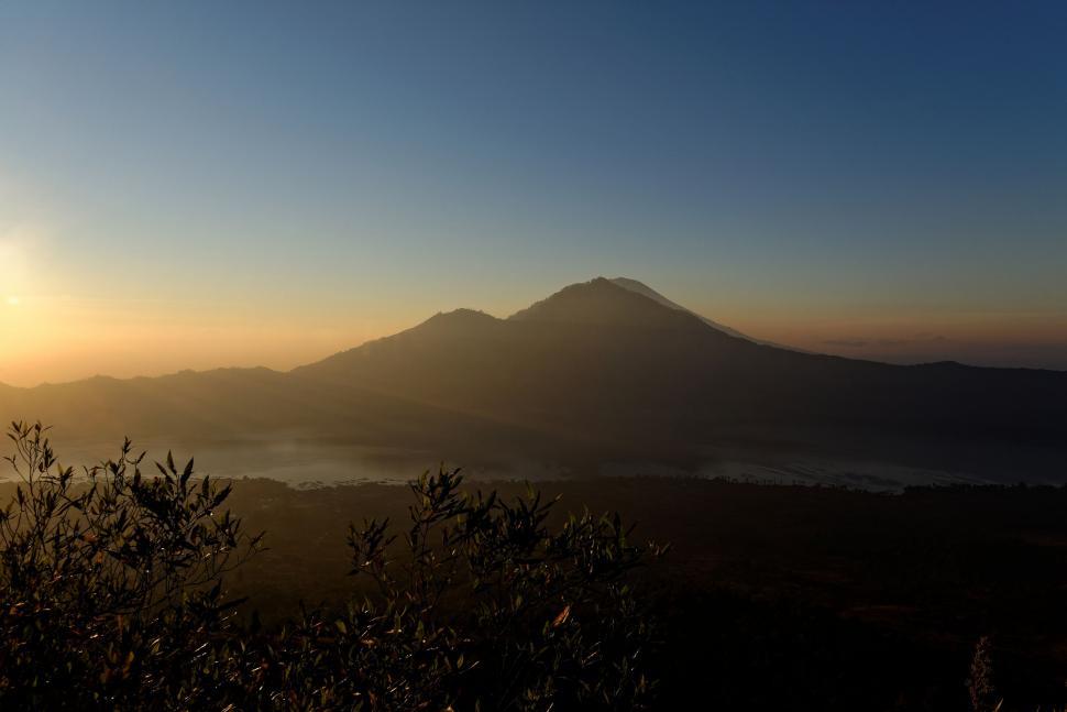 Free Image of Sun Setting Over Mountain Range 