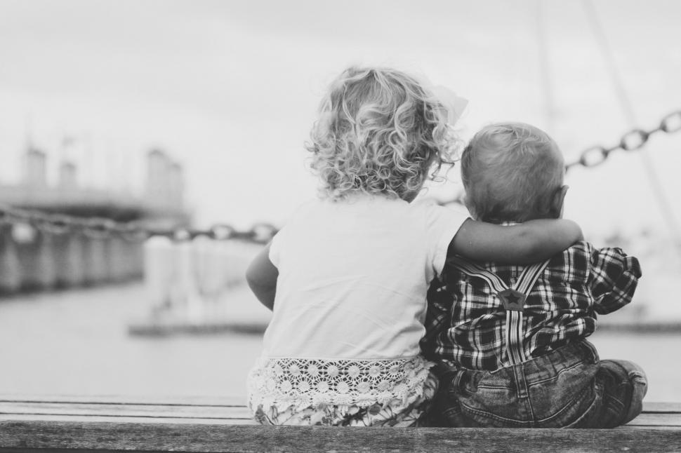 Free Image of Kids Sitting on Top of Wooden Bench 