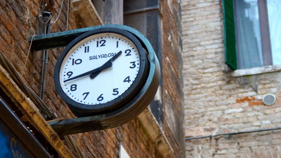 Free Image of Clock on the Side of a Building 