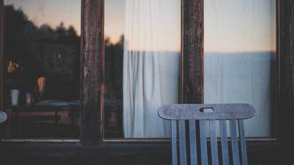 Free Image of Wooden Chair in Front of Window 