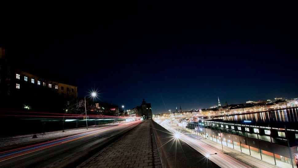 Free Image of City Street at Night With Lights On 