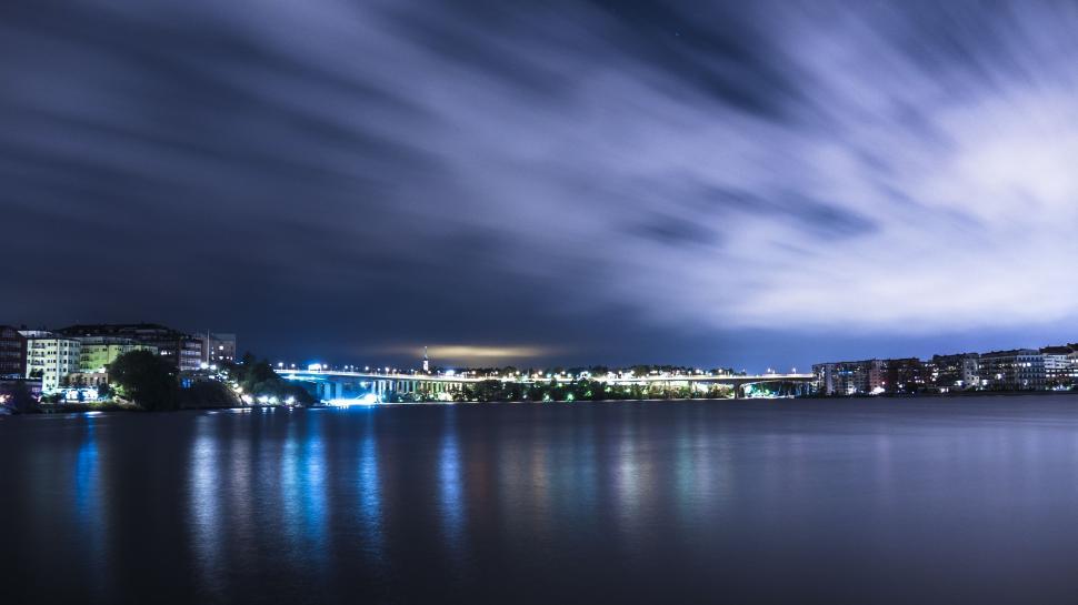 Free Image of Cloudy Sky Over Large Body of Water 