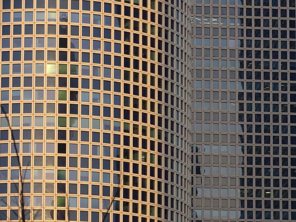 Free Image of Plane Flying in Front of Very Tall Building 