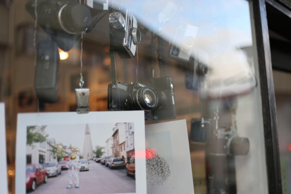 Free Image of Window Covered With Multiple Pictures 