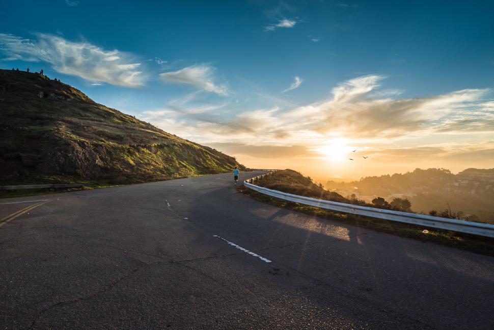 Free Image of Person Riding Skateboard Down Road 