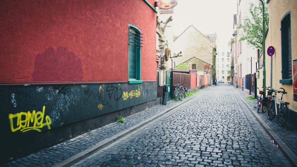 Free Image of Brick Street With Graffiti 