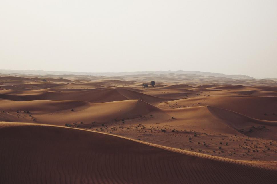 Free Image of Bus Driving Across Desert Landscape 