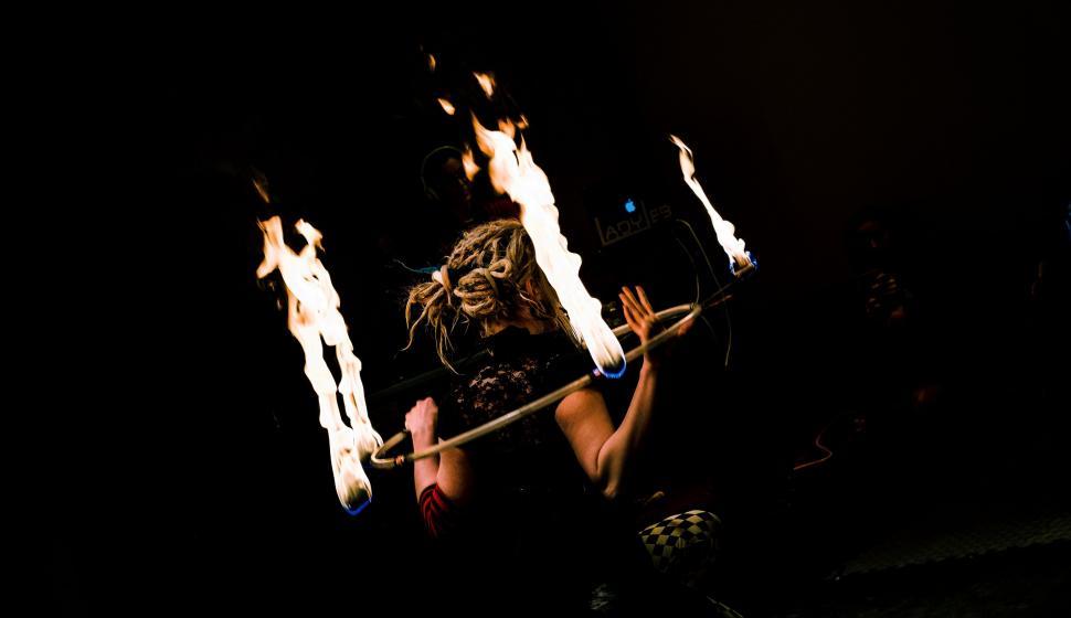 Free Image of Man Holding Flaming Stick 