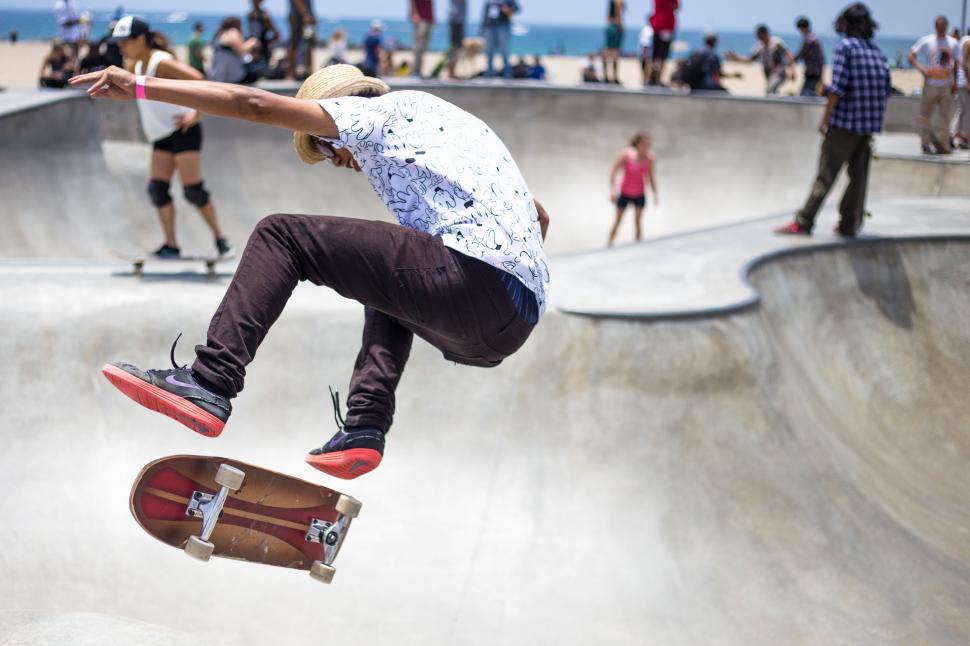 Free Image of Man Flying Through the Air on Skateboard 