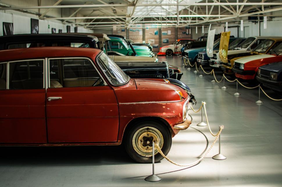 Free Image of Old Red Car Parked in Garage 